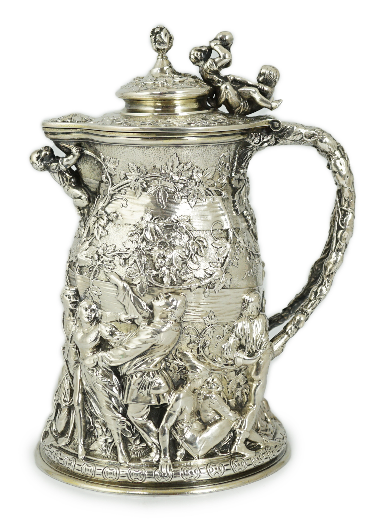 ROYAL INTEREST: A good ornate Victorian Teniers style silver ewer with hinged cover by Frederick Elkington